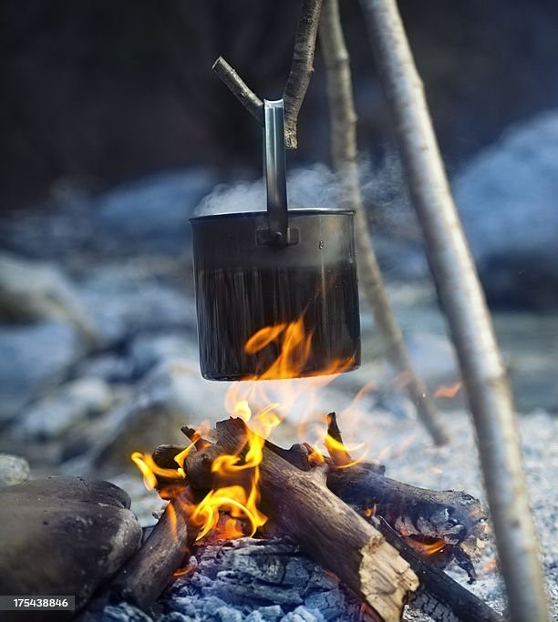 Fire buring and a pot above it